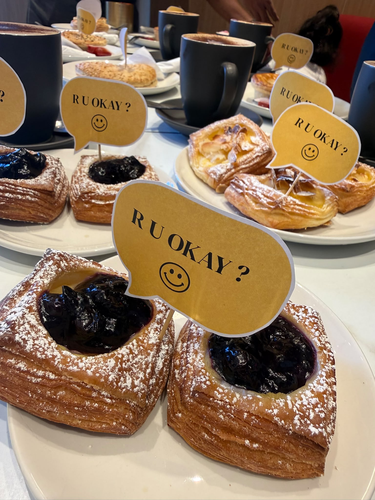 Sweet treats decorated with R U OK? toppers
